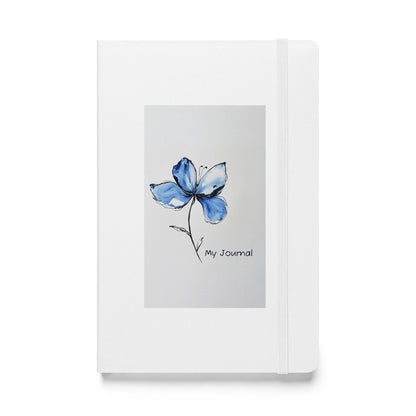 Product mockup of a white journal with a Blue Butterfly Bean flower on it and the words My Journal